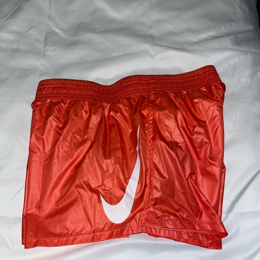 Orange Nike athletic shorts